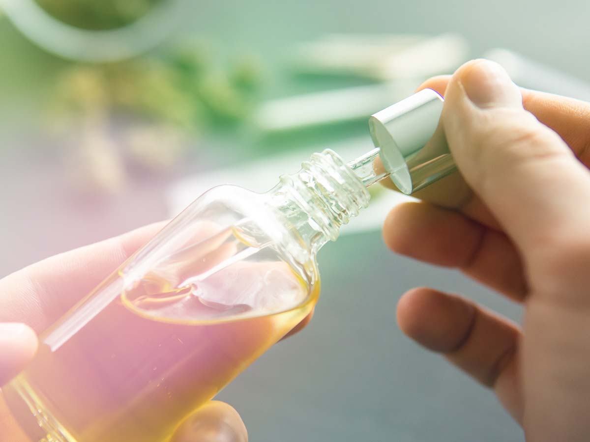 opening CBD bottle